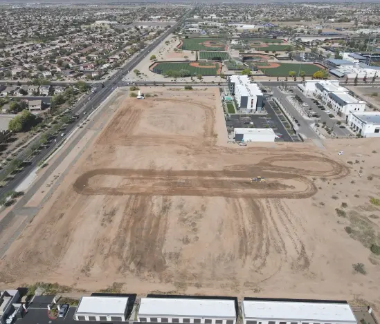 A photo of an acquired dirt lot for one of Ridgehouse's residential properties.