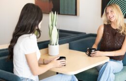 Clubroom cafe with 2 women having coffee