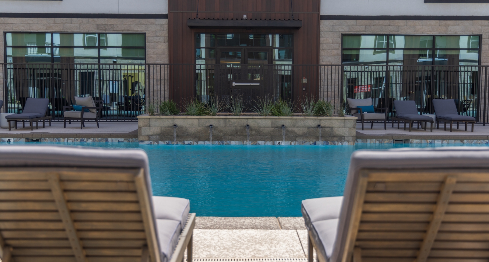 2 lounge chairs by the pool